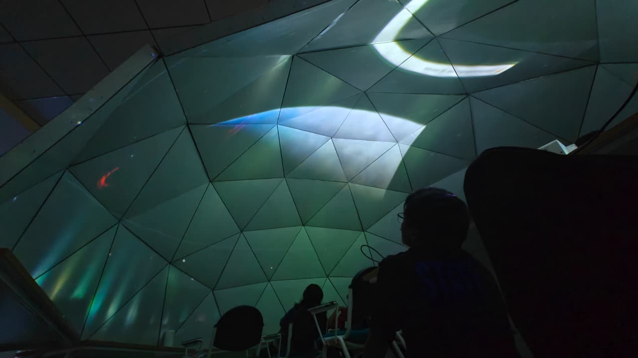 Interior of a planetarium dome with projected stars